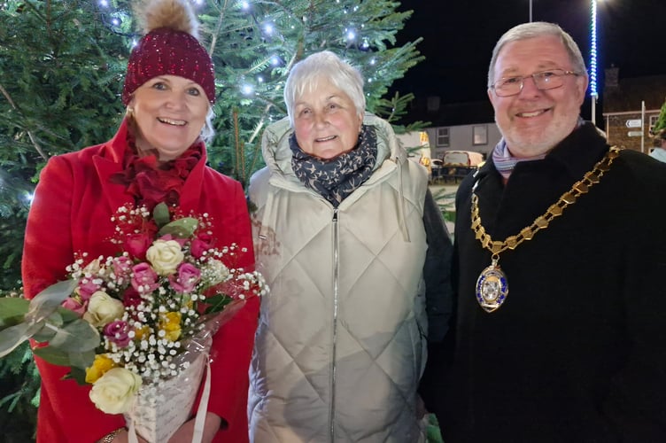 Hairdresser Hayley Revell, who switched on the lights, is pictured with Llanbadarn councillors 
Linda Keeler and Gareth Davies