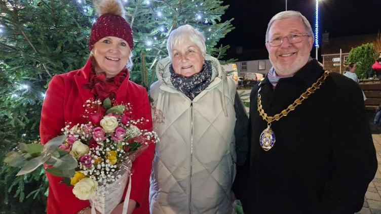 Hairdresser Hayley Revell, who switched on the lights, is pictured with Llanbadarn councillors 
Linda Keeler and Gareth Davies