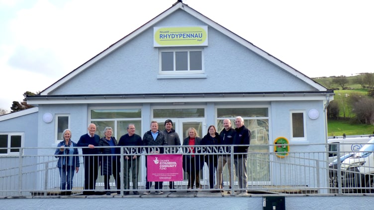 Outside the newly painted and improved frontage showing bespoke railings and overhead signage are, from left to right, Ceri Jones, Vaughan Griffiths, Lila Piette, Arwel George, Dave Reed, Owen Evans, Annette Keyworth, Rachel Richards, Rhys Lewis and Guy Jones