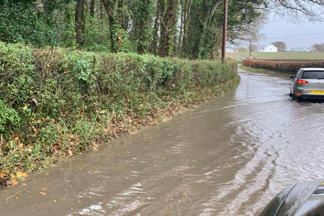 Flood warnings, waterlogged roads and flying tiles