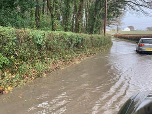 Flood warnings, waterlogged roads and flying tiles