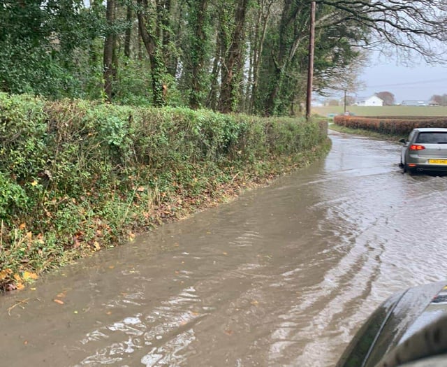 Flood warnings, waterlogged roads and flying tiles