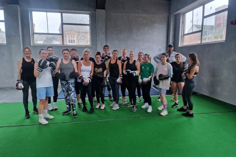 Jamie Ambler (right) coaching the women-only class at Jay Jay's Amateur Boxing Club