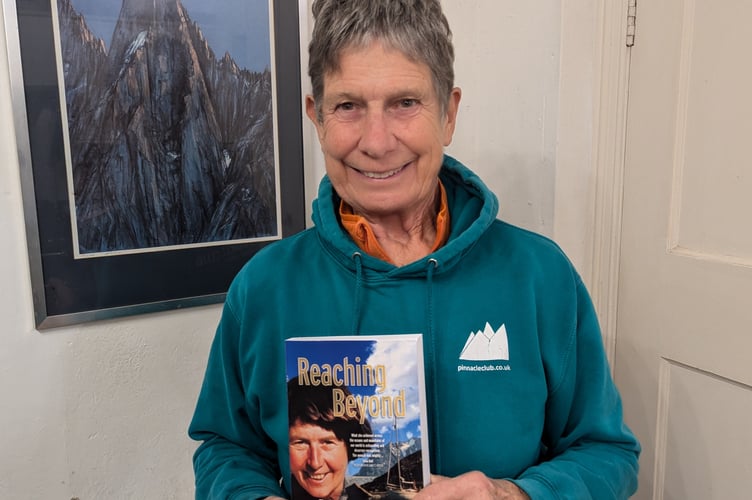 Cathy with the book by Denise Evans that she has published