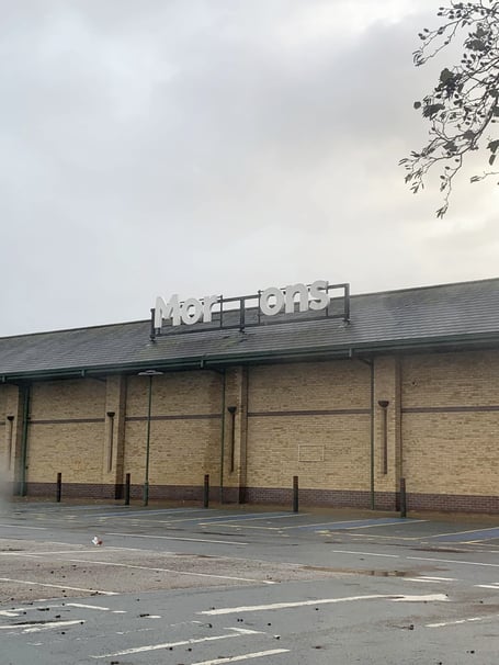 The damaged 'Morrisons' sign at Morrisons' supermarket in Aberystwyth, Ceredigion, Wales.  Photo released December 10 2024. Supermarket bosses are rushing to fix an offensive sign exposed as part of Storm Darraghs destruction.Joshua Jones, 26, snapped pictures of the offensive message as he visited the supermarkets location in Aberystwyth, Ceredigion, Wales.His first thought while seeing the sign was that it was the English word morons  referring to stupid people.However, in Wales, the word moron can also have a different meaning  translating into English as carrot.