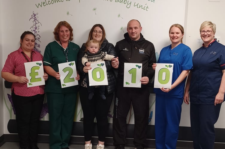 Lowri Davies and Jordan Jones with staff from the SCBU