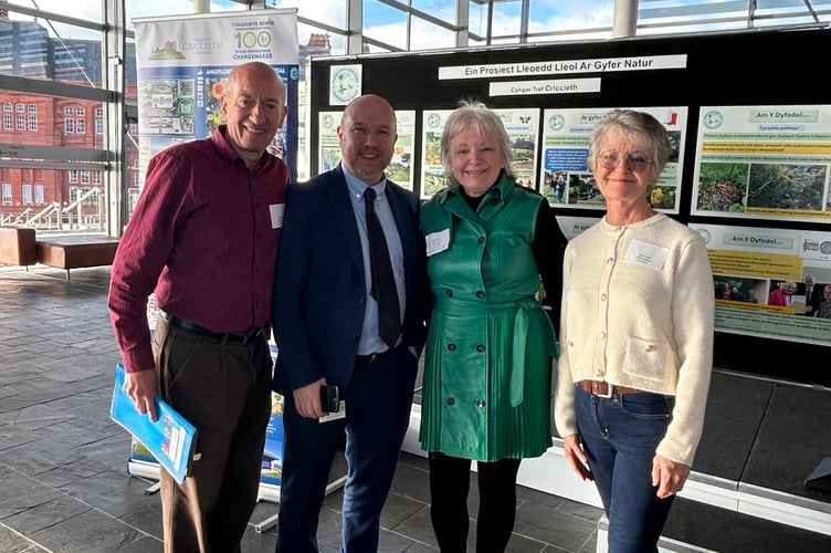 Jackie Kirk and David Cassells, Friends of the Nature Garden members, and town clerk Catrin Jones represented the project, with MS Mabon ap Gwynfor
