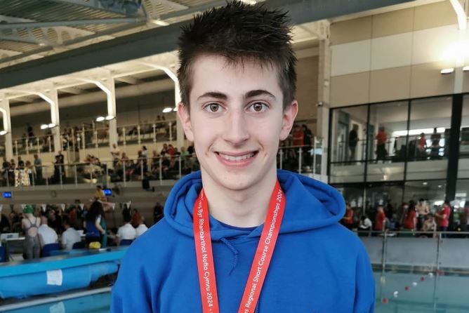 Captain Ivan Rukov with his silver medal for the 100m freestyle