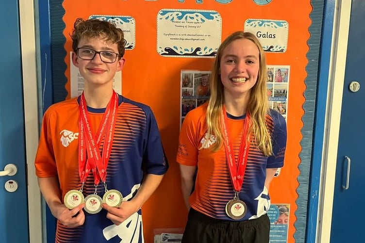 Wilf Thomas and Gwennan Filmer with their well earned medals from the meet