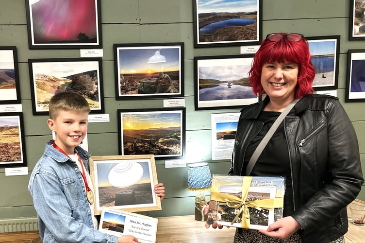First prize winner Noa Jac Hughes (left) and second place winner Cllr Rwth Hughes (right) with winning photos and prizes