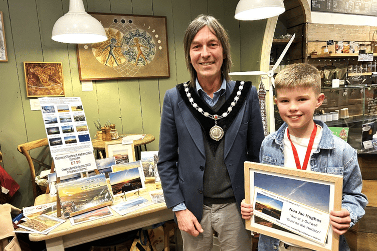 11-year-old Noa Jac Hughes with his winning entry and prize, presented by Machynlleth Mayor Jeremy Paige
