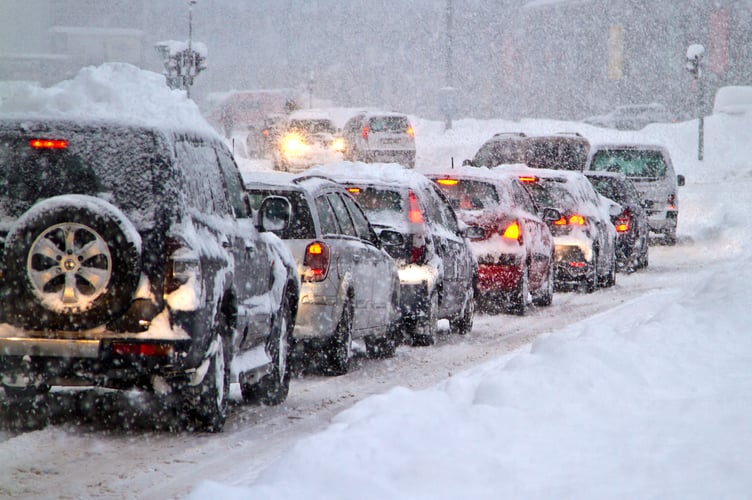 Blizzard on the road. Photo taken 07. februar 2013 in Slovakia Europe town Liptovsky Mikulas. Heavy snowfall paralyzed traffic for several hours.