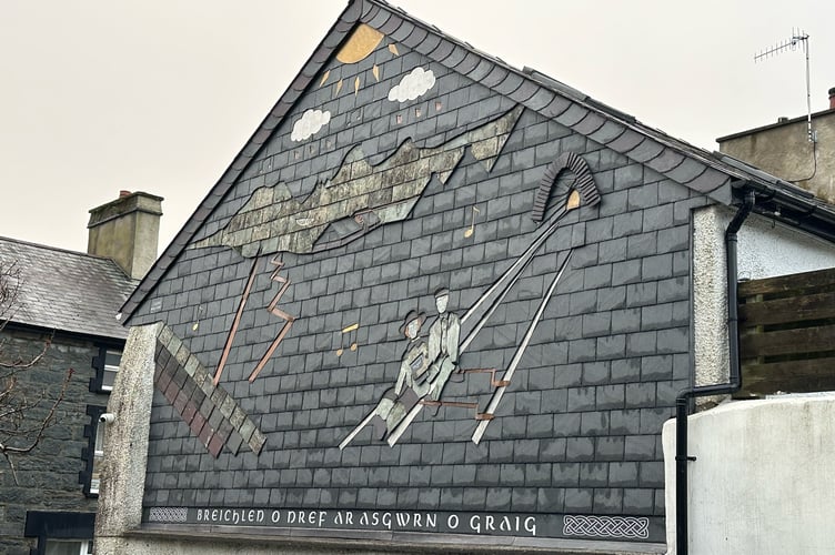 The slate mosaic, on the gable end wall of Beatons accountants in Blaenau Ffestiniog
