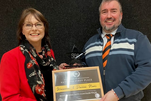 Trudy Davies receiving her award for her business Woosnam and Davies News from MP Steve Witherden