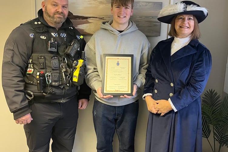 The High Sheriff's Award Certificate was presented to Kyle Jellicoe by the High Sheriff of Gwynedd Sarah Foskett JP. Also pictured is Sergeant Gary Wells from North Wales Police.