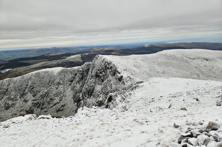 Snow topped Cadair Idris/ Penygader looking west out to sea on January 4