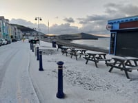 Snow settles on promenade as police issue ice warning