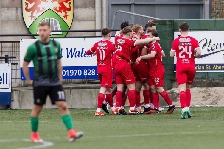 ABERYSTWYTH, WALES - 11 JANUARY 2025: Briton Ferry's Thomas Walters scores his 2nd goal of the game and celebrates to lead 1-3 during the 2024/25 JD Cymru Premier league fixture between Aberystwyth Town FC & Briton Ferry Llansawel AFC at Park Avenue, Aberystwyth, Wales (Pic by John Smith/FAW)