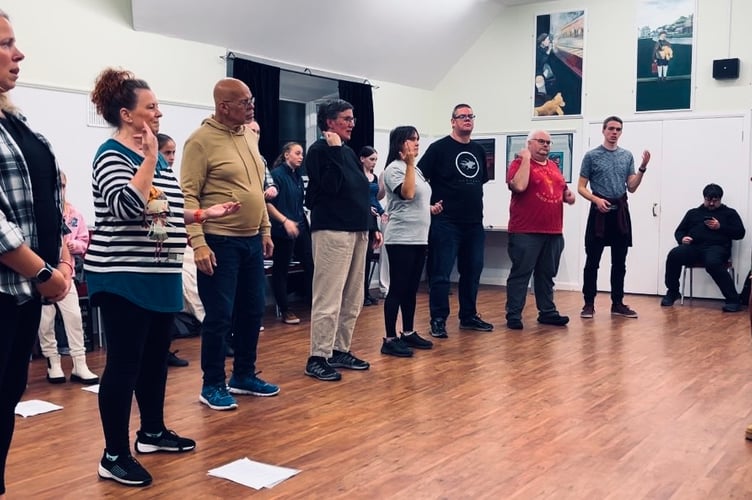 Lauren teaching some BSL to the cast