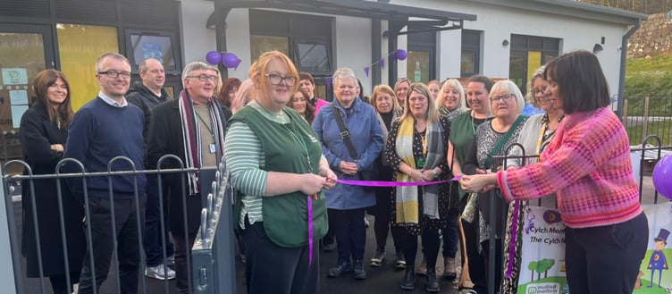 Leader Ayesha Tudor with Dr Gwenllian Lansdown Davies cutting the ribbon to officially open the Cylch Meithrin
