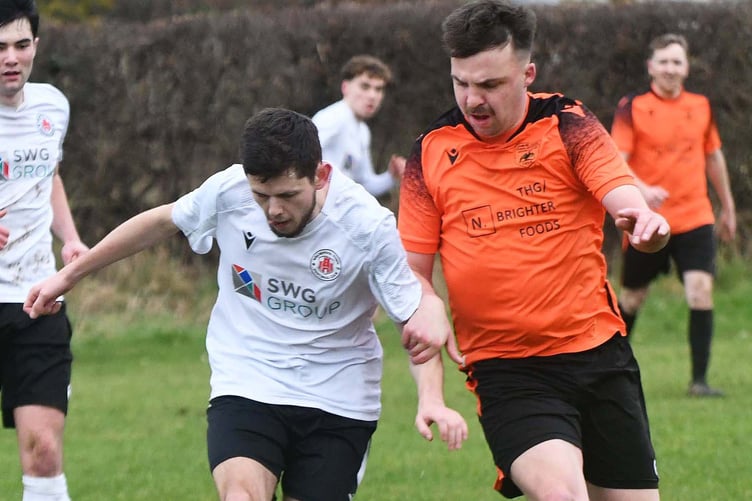 Tywyn's Dave Jenkins goes in for a tackle