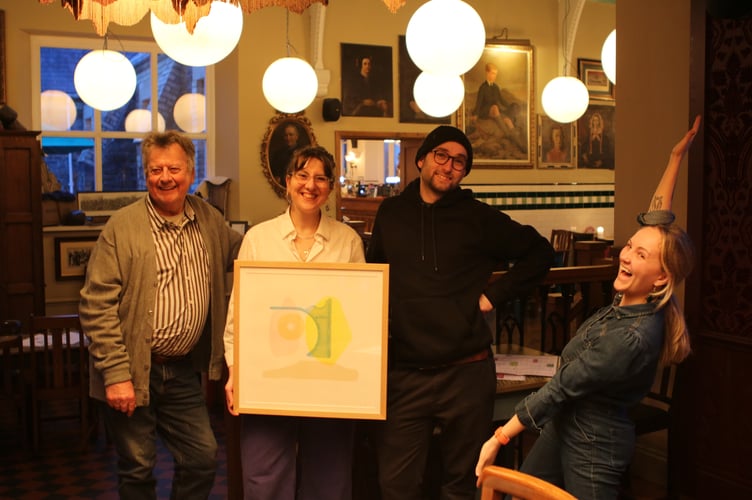 Roger Fuller, print maker Harrie Fuller and illustrator Sam Bedworth, with Esme from Athro Lounge. Photo: Isaac Peat