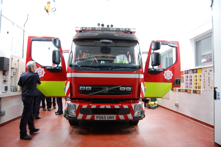 Louis Hiatt, Watch Manager for Tywyn and Aberdyfi Fire Stations, with the Tywyn appliance during a drill night at the station