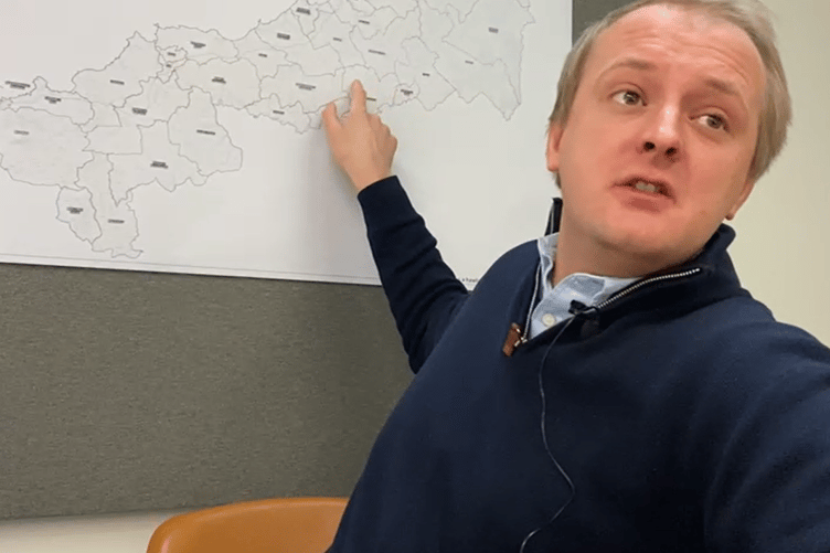 Ben Lake with his new constituency map explaining the boundary changes from his Westminster office