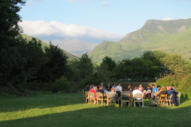 A group meeting on the lawn at Trigonos
