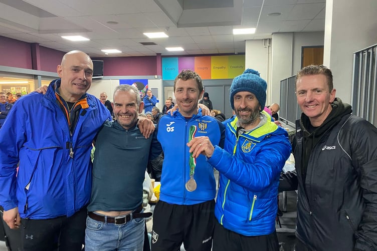 Aber AC celebrating their cross country promotion