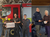 Knitters and firefighters donate to Aberystwyth RNLI 