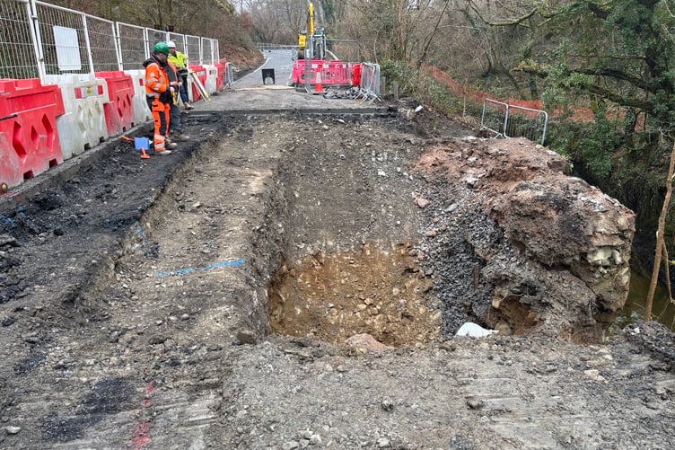The road works - excavating in preparation for the re-construction of the wall has now begun.