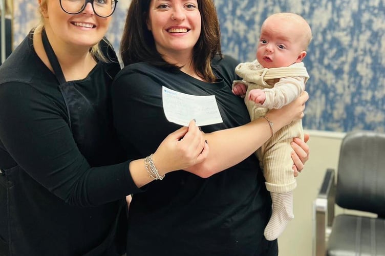 Baby Hefin is pictured at five months old with his mother, Lauren, and Studio58 owner, Sophie