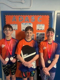 Wilf Thomas with his medals from the regionals along with vice captain Oli Lerigo and medalist Gwennan Filmer