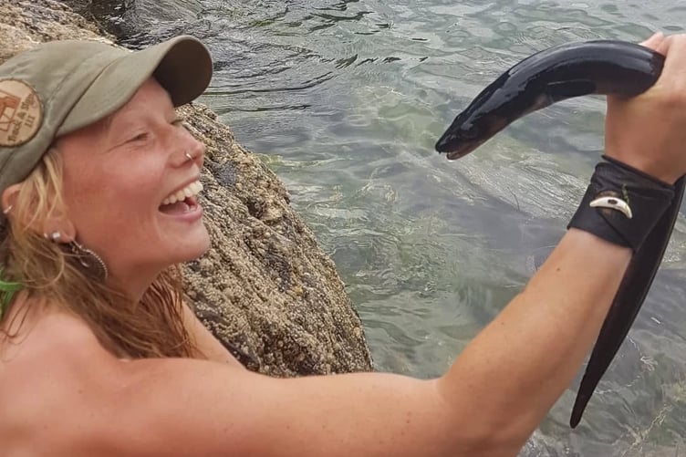 Kara, a bushcraft instructor, with her catch