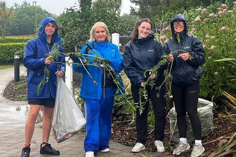Hafan y Mor general manager Denise Bossons, second left, joins staff on a litter pick at the award-winning holiday park near Pwllheli
