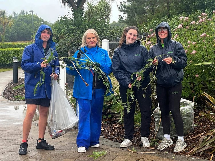 Hafan y Mor general manager Denise Bossons, second left, joins staff on a litter pick at the award-winning holiday park near Pwllheli