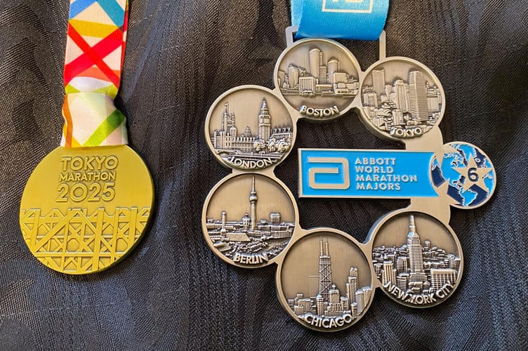 Pauls Tokyo medal alongside his major medal memento