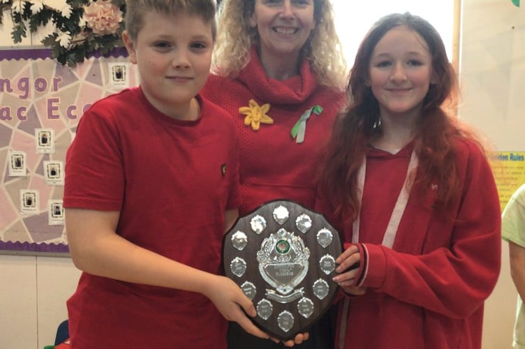 Captains Henry Heley and Phoebe Colley from winning team Teilo with their shield with Mrs Macy-
