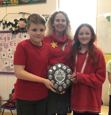 Captains Henry Heley and Phoebe Colley from winning team Teilo with their shield with Mrs Macy-