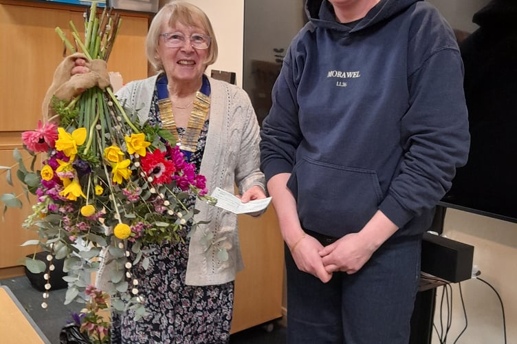 Tywyn Inner Wheel President, Lynda Morris, presents a cheque to florist Ellen Jones of Morawel, for her chosen charity, Motor Neurone Disease