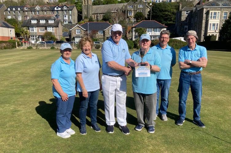 The players Town team, Colin Hopkins, John Johnson and Roy Burford, are to the right, and to the left for Country are Patrick Martin, Pauline Owen and Julie Taylor