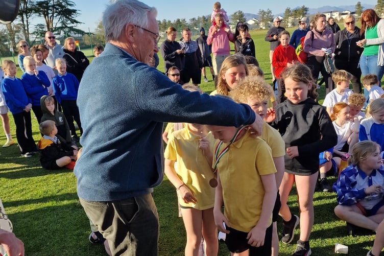 Edmund Bailey, Honourable President of CRH, presenting the medals at the tournament