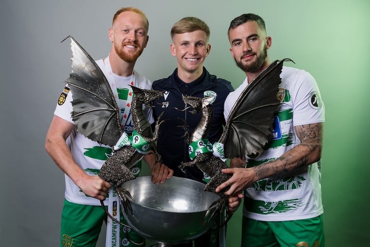 OSWESTRY, ENGLAND - 11 APRIL 2025: The New Saints Sion Bradley, The New Saints' Leo Smith and The New Saints' Dafydd Gwion pose with the trophy after winning the league during the Second Phase of the JD Cymru Premier 2024/25 Championship Conference league fixture between The New Saints FC & Bala Town FC at Park Hall, Oswestry, Wales. (Pic By John Smith/FAW)