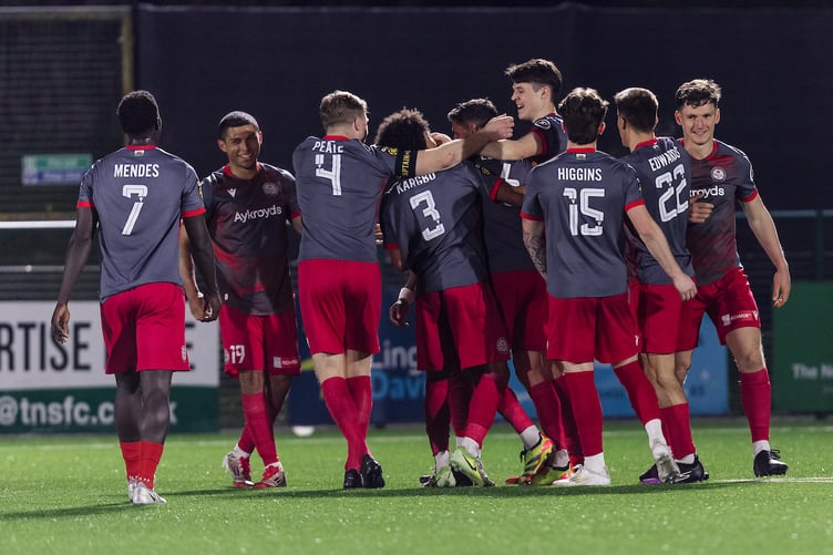 OSWESTRY, ENGLAND - 11 APRIL 2025: Bala Town's Osebi Abadaki scores and celebrates 1-1 during the Second Phase of the JD Cymru Premier 2024/25 Championship Conference league fixture between The New Saints FC & Bala Town FC at Park Hall, Oswestry, Wales.  (Pic By John Smith/FAW)