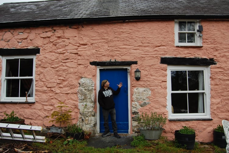 Scott outside his home, the two bed cottage