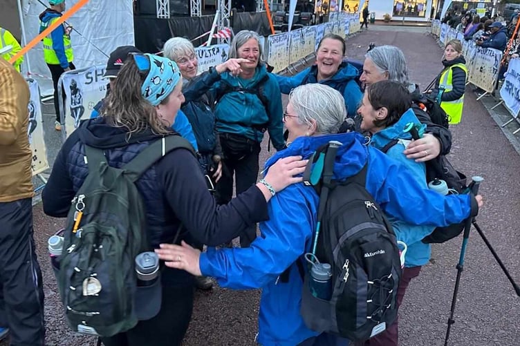 The ladies celebrate after completing SheUltra