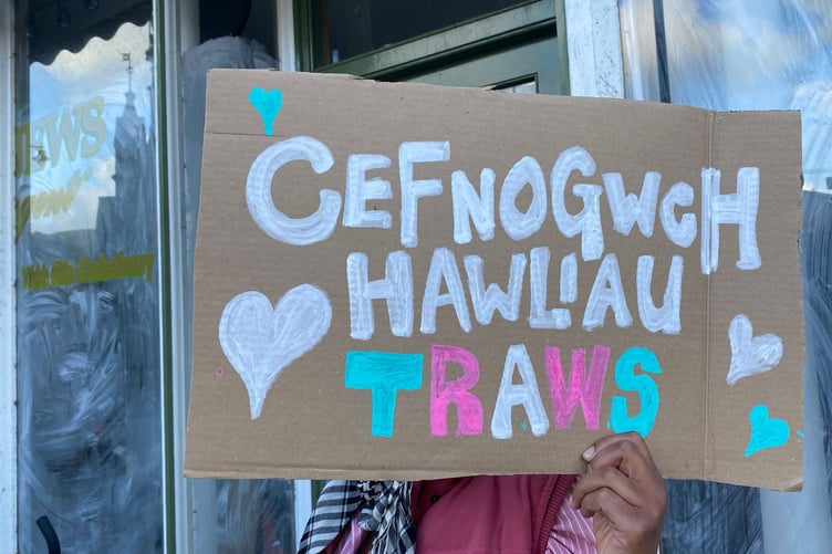 A placard in Welsh called for others to 'support trans rights'