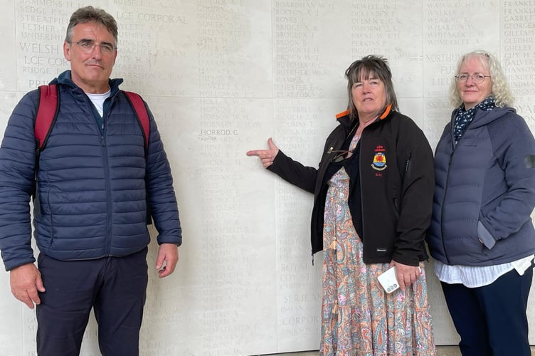 Rhian Medi Jones, conductor of Cor Meibion Clwb Rugby Aberteifi, points to the name of her great-uncle, Pvt Richard (“Dick”) Jenkin Isaac, of Taliesin, on the Vis en Artois Memorial in France. She is flanked by her brother, Dafydd Jones, and choir supporter Eirlys Richards, a distant relative of the soldier.
