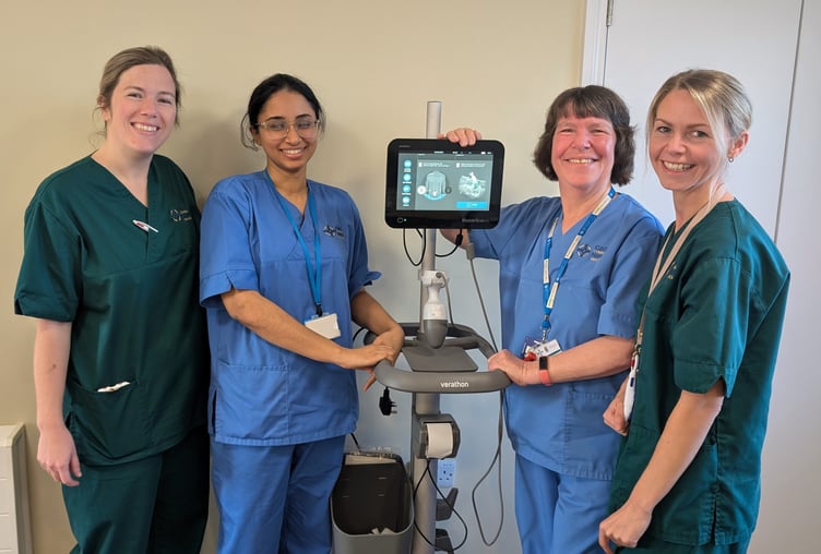 Staff from Y Banwy ward with the bladder scanner